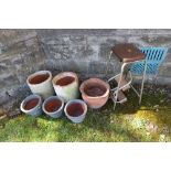 A collection of garden pots, and a set of steps