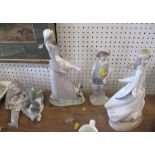 Four Lladro models, the girl has lost a finger, the boy is in good condition, the girl and goose