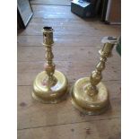 A pair of brass candle sticks