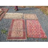 An eastern style rug, with medallions in a central field to a patterned border 45ins x 28ins,