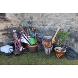 A large collection of assorted garden tools, pots, hanging baskets, etc.