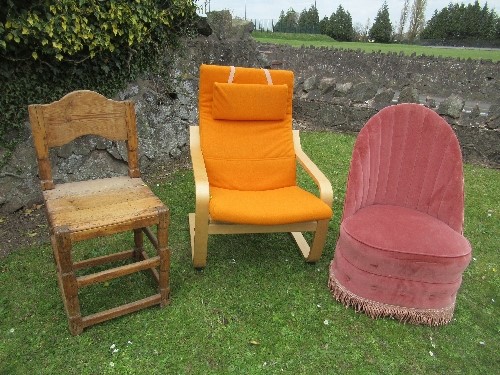 A pine chair, together with an orange upholstered Swedish style open arm chair, and a pink