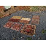 Two kilim style fragments 22ins x 19ins and 20.5ins x 18ins, together with a small rectangular panel