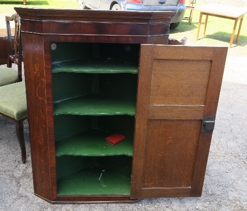 An Antique oak corner cupboard, with mahogany banding to the door, fitted with three shelves, - Image 2 of 2