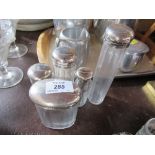 Five silver mounted glass dressing table bottles