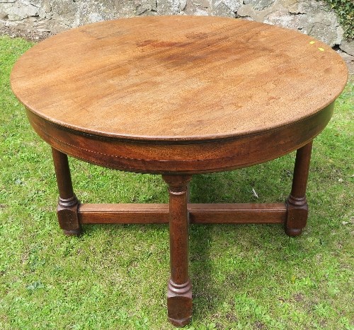 A 19th century mahogany circular table, raised on four legs united by a cross stretcher diameter