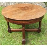 A 19th century mahogany circular table, raised on four legs united by a cross stretcher diameter