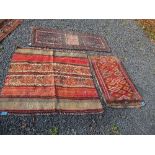 Two kilim style rugs 42ins x 38ins and 38.5ins x 21.5ins, and a saddle bag 55ins x 23ins, Sold in as