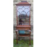 An Edwardian mahogany display cabinet, with C scroll glazing bars, the base fitted with a drawer