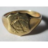 A monogrammed signet ring, stamped '9ct', finger size Q 1/2, 4.4g gross