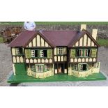 A Tri-ang dolls house, width 48ins. height 27ins, depth 17ins, together with accessories