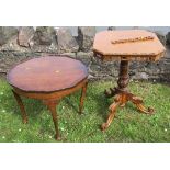 An oak tripod table, with pierced and carved edge, carved turned column to three scroll legs, top