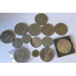 A collection of commemorative coins to include Churchill 1965 example, JFK half dollar, etc.