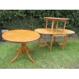 Two round pine tables, 35ins x 19ins and 29ins x 30ins, together with pine drop leaf kitchen