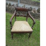 A 19th century mahogany bar back open armchair, raised on turned legs