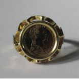 A ring set with a faux 'coin', stamped '585, 2.8g gross