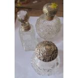 Three silver and glass mounted dressing table bottles