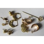 A quantity of 9 carat gold earrings, together with a stickpin of equestrian interest