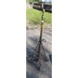 A telescopic oil lamp base stand, raised on four supports height 49.5ins