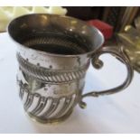 A silver cup, with embossed decoration and engraved inscription, London 1900, weight 3oz