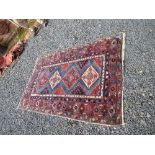 An Eastern design rug, decorated with four central medallions to a blue ground and patterned border,