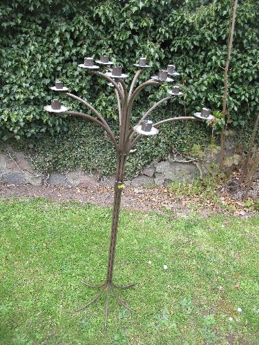 A metal 12 branch candle stand