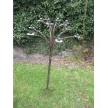 A metal 12 branch candle stand