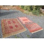 An Eastern design rug, decorated with two rectangular panels to the central field, 55ins x 48ins,