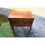 A three drawer walnut veneered cutlery table, containing a quantity of Community Plate cutlery and