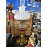 A brass and glass oil lamp