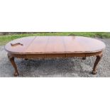 A mahogany extending dining table, with D ends, carved knees and claw and ball feet, length 93ins,