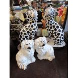 A PAIR OF MODELS OF BLACK AND WHITE DOGS, ONE AF, HEIGHT 10.5INS, TOGETHER WITH TWO BESWICK SPANIELS