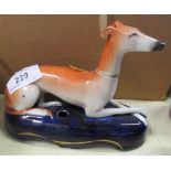 A Staffordshire  model of a recumbent greyhound