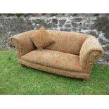 A two seater sofa, with fire labels, width 69ins x depth 37.5ins x height 30ins