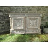 A large continental style painted sideboard, having carved frieze over two cupboard doors opening to