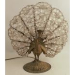 A 1920's/30's gilt metal lamp base, formed as a peacock with the tail being formed as cut clear
