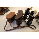 Two pairs of cased binoculars, one by A G and Co Limited, the other by Ross of London, and another