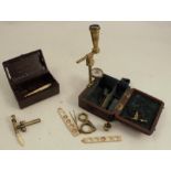 A Cary London lacquered brass portable pocket compound microscope, with slides, tweezers, lens