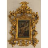 A late 17th century oil on copper, child holding flowers, 4.25ins x 3ins, in an ornate gilt scroll