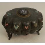 A Victorian jewellery box, the shaped oval metal box with enamel leaf decoration, set with a