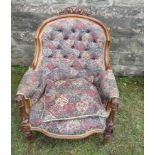 A 19th century show wood grandfather's chair, with deep button upholstery and fluted front legs