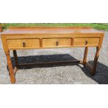An oak serving table, by Squirrel man Wilf Hutchinson, fitted with three drawers, 54ins x 16ins,