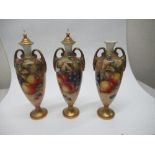 A pair of Royal Worcester covered vases, decorated half round with hand painted fruit by Ayrton,