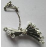 A diamond spray brooch, in unmarked white metal, the fourteen old brilliant cuts totalling