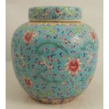 A Chinese ginger jar and cover, decorated in the famille verte pattern to a turquoise ground with