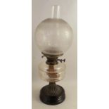 A Victorian oil lamp, with etched glass shade, glass oil reserve on a gilt metal column, height