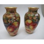 A pair of Royal Worcester vases, decorated all around with hand painted fruit by Higgins, shape