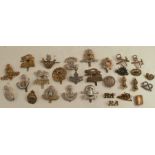 A collection of cap badges, mainly military, to include Tank Regiment, North Stafford, Suffolk,