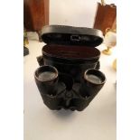 A pair of cased Dienstglas 7x50 binoculars, stamped 366243M, in a black case