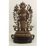 A 20th century Mongolian white metal model, of a Bodhisattva, standing on a lotus throne, wearing